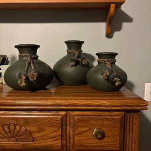 Dark green clay pots with rope accents.various sizes